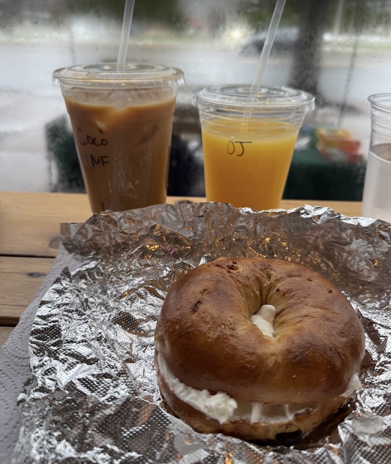 Iced coconut latte, fresh OJ and a cream cheese bagel at our window seat